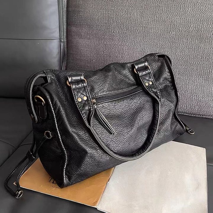Schwarze Lederhandtasche mit Reißverschlusstaschen